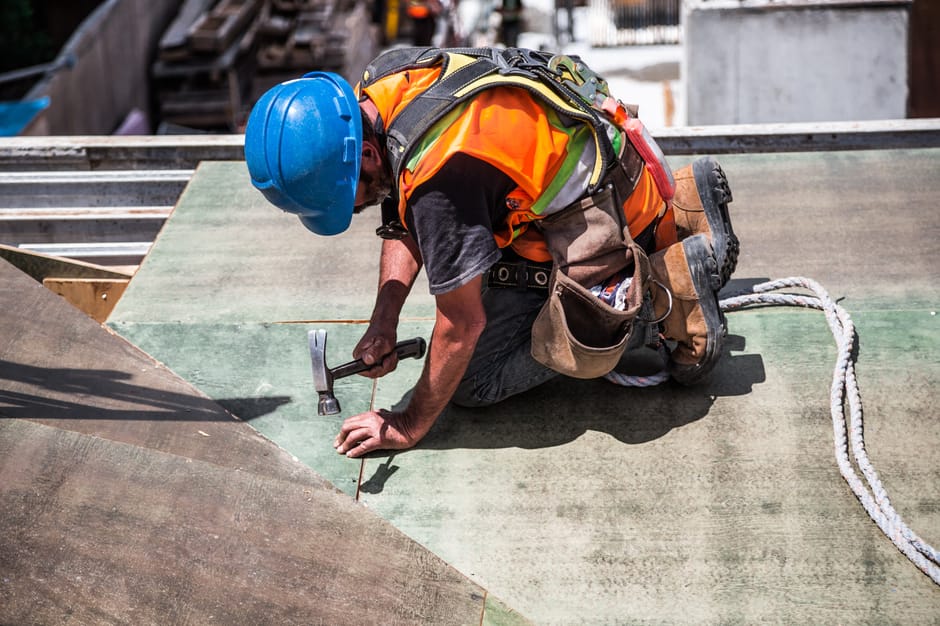 Emergency roof repair specialist in action